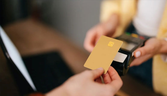 Customer completing a payment at a gun store POS