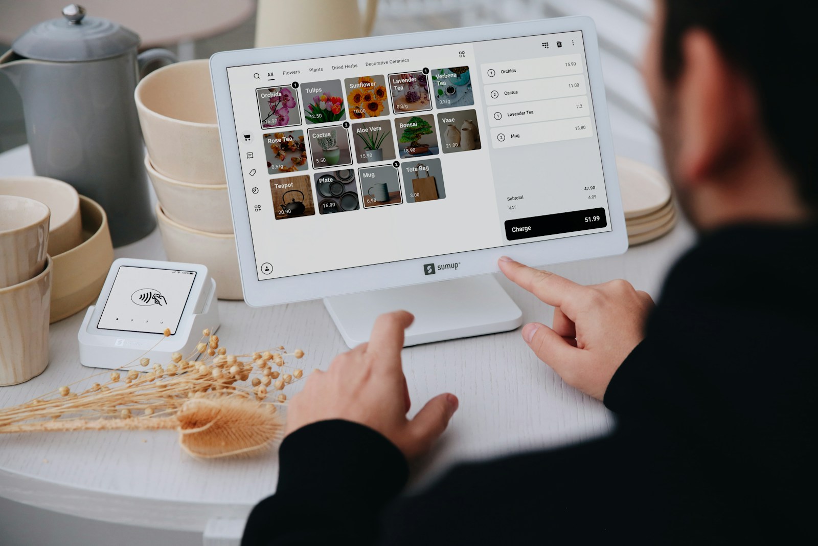 Retail employee using a modern point-of-sale system